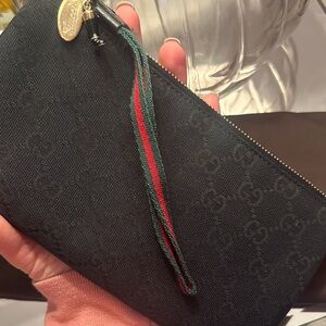 Gucci GG Black Canvas Zip Wristlet with Gold Accents